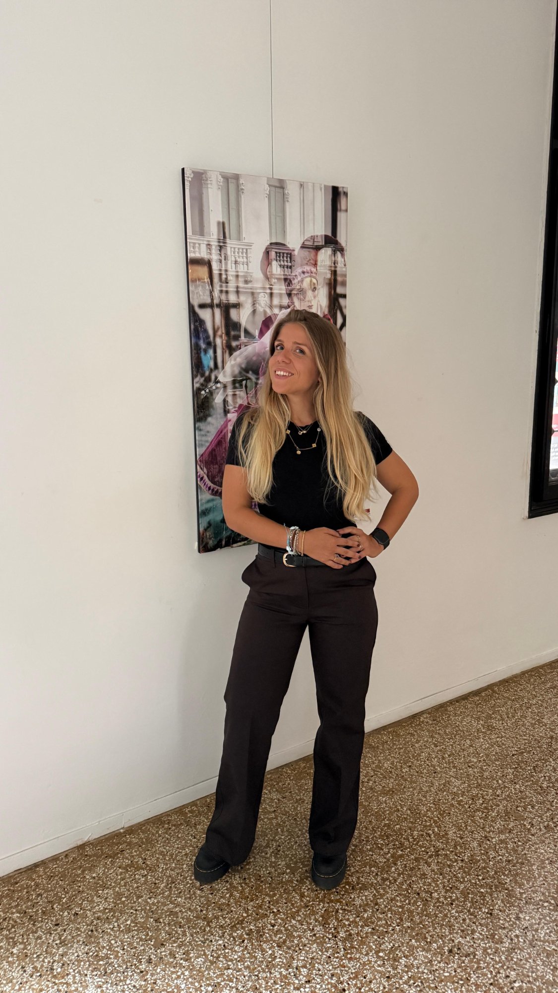 Ludovica Benedetta Dagna in front of a contemporary artwork